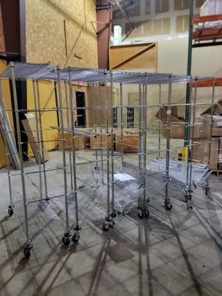 Lot of six Metro Super Erecta mobile shelving units with chrome-plated wire, stem casters, and additional shelves for custom storage.