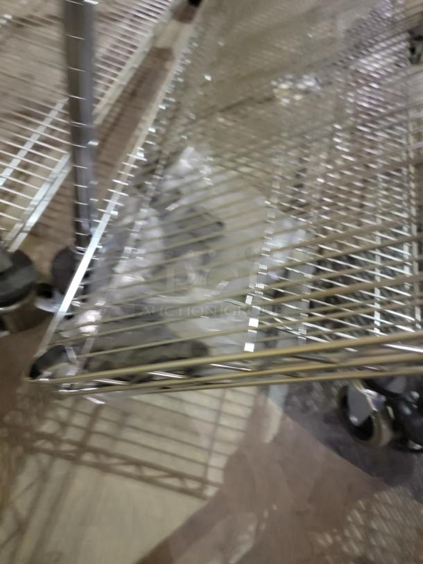 Lot of six Metro Super Erecta mobile shelving units with chrome-plated wire, stem casters, and eight additional shelves.