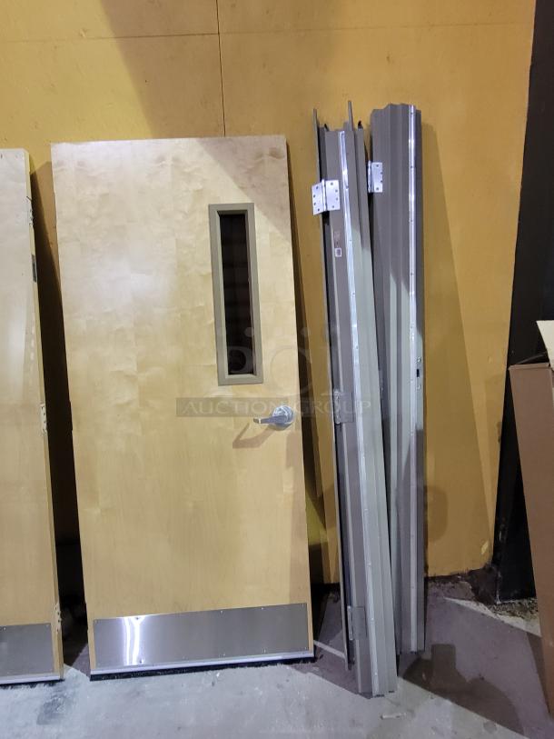 Lot of 2 Lambton 20-minute fire-rated wood doors with frames, solid core, slim vision lite, metal frames, stainless steel kick plate.