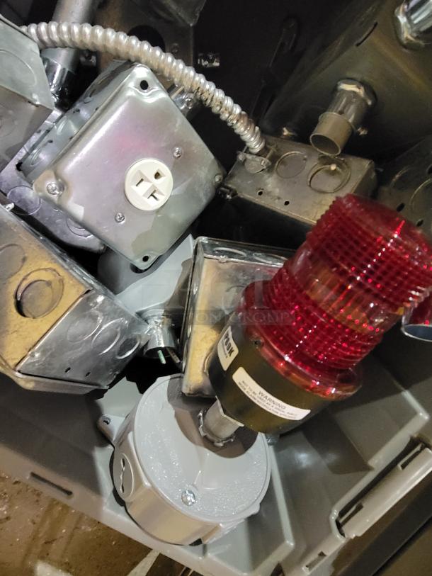 Various manufacturers industrial electrical enclosure and junction box 2-bin lot featuring galvanized steel, pre-wired components, NEMA-rated enclosures, and red IP69K beacon.