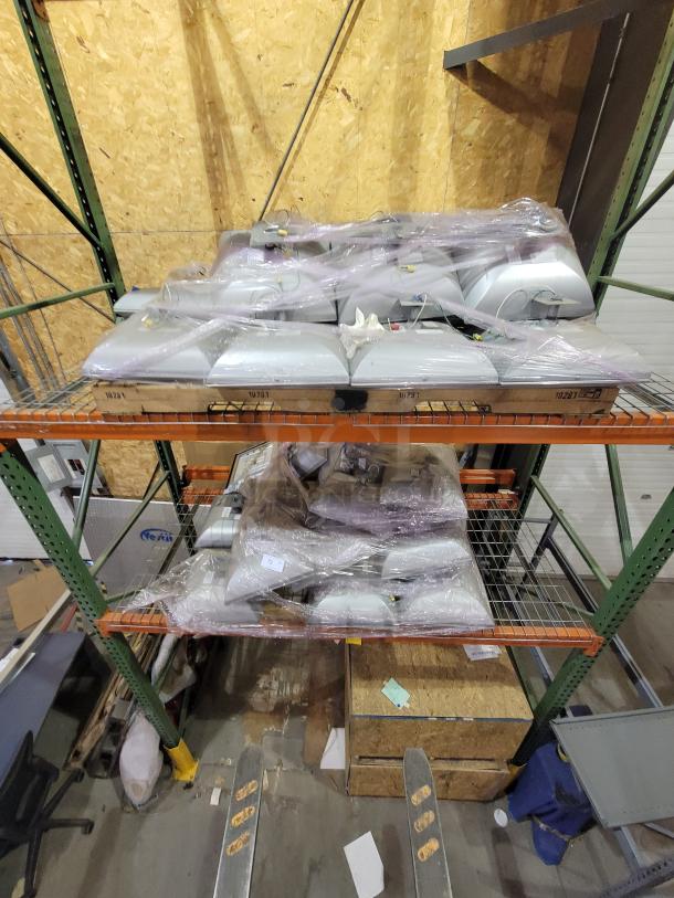 Two pallets of LSI Crossover LED canopy lights, industrial-grade, high-efficiency, wet location rated, energy-saving.