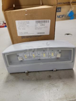 Lot of 7 H.E. Williams LED Wall Lights; satin aluminum finish, micro-prismatic lens, 2,000 lumens, 4000K, IP65 rated.