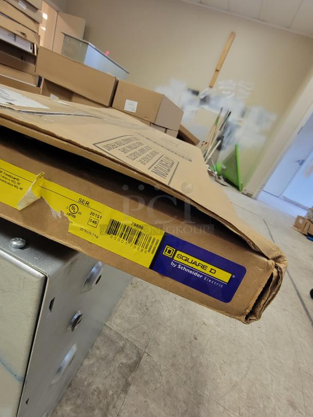 New Square D by Schneider Electric panelboard enclosures in original packaging. Includes models MH32, MH38, MH50 with cover.