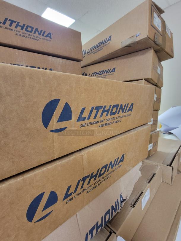 Stacked boxes of Lithonia Lighting ZLR L24 SYM WH reflector kits. Brand new, original packaging, includes mounting hardware.
