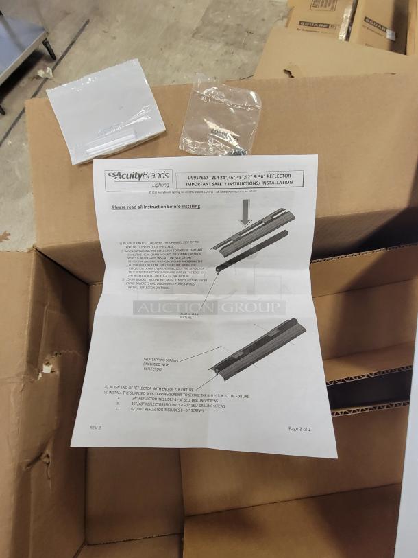 New Lithonia Lighting ZLR series reflector kits, model ZLR L24 SYM WH. Lot of 14 kits, high-gloss white, new old stock, includes mounting hardware and instructions.