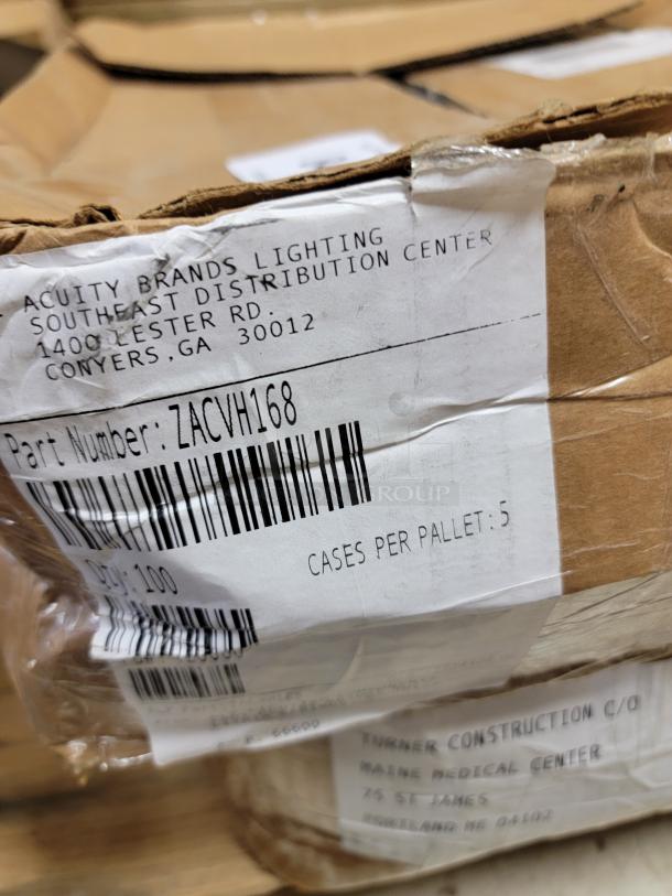 Three factory-sealed boxes of 300 Lithonia Lighting ZACVH aircraft cable grippers. Labels detail distribution info and part number.