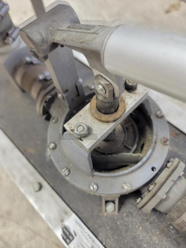 Kenrich Products Grout Pup GP-2 hand pump with visible lever mechanism, durable build, and label indicating make and model.