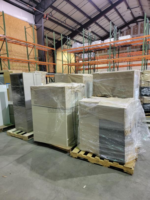 10-pallet lot of Steelcase and Global commercial steel storage cabinets, wrapped in plastic, in a warehouse.