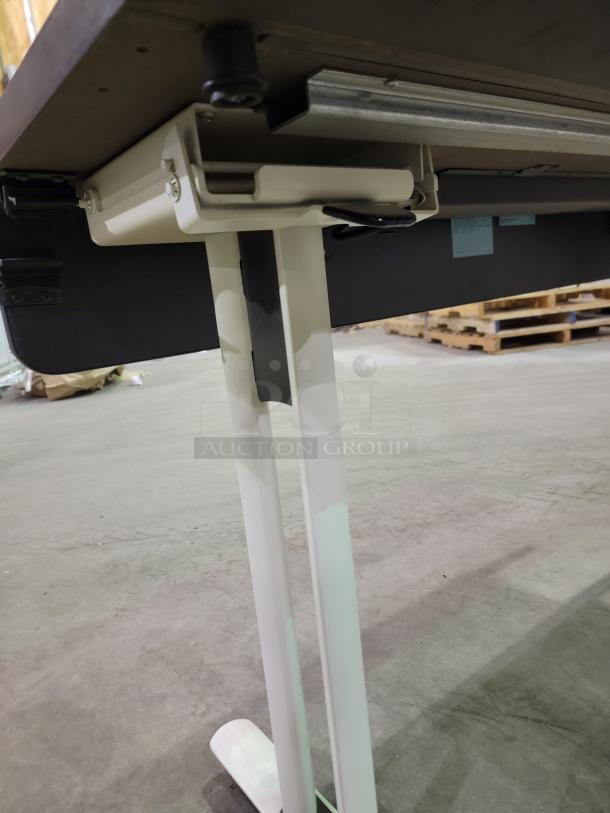 LOT OF 4 Krueger International Synthesis nesting tables with flip-top mechanism, pop-up power modules, and T-leg base on casters.