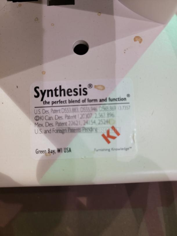 KI Synthesis table label with patent details, "Synthesis: the perfect blend of form and function," by Krueger International.