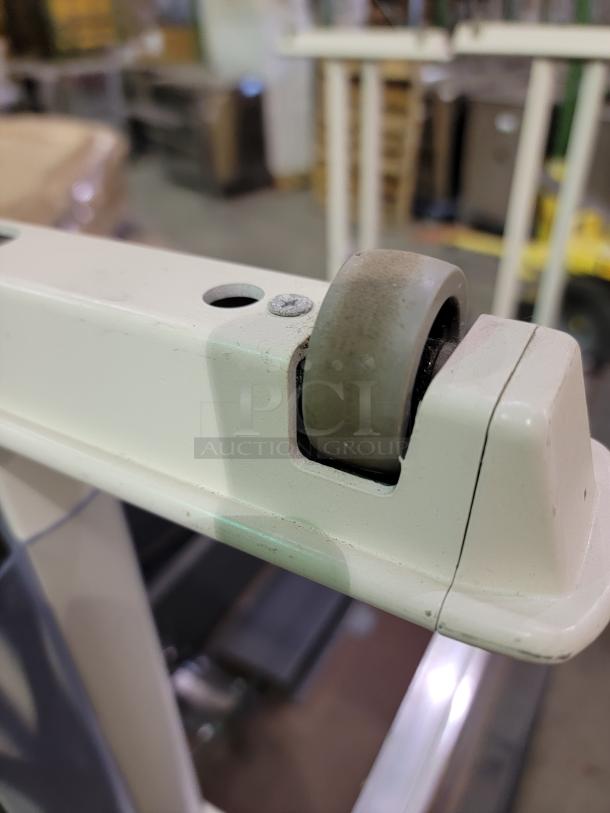 Industrial caster on Krueger International Synthesis nesting training table, showcasing durable construction and mobility feature.