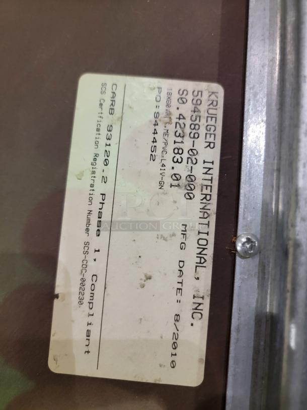 Label on Krueger International table, showing model 594589-02-000, MFG date 8/2010. Phase 1 Compliant.