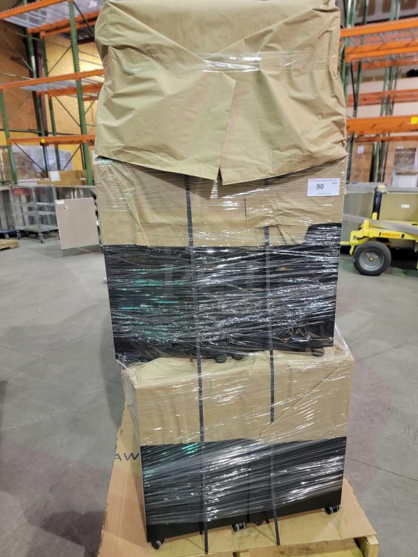 HP M2705A mobile storage pedestals, 2-pallet bulk lot, wrapped in plastic, on wheels for easy mobility. Auction tag visible.