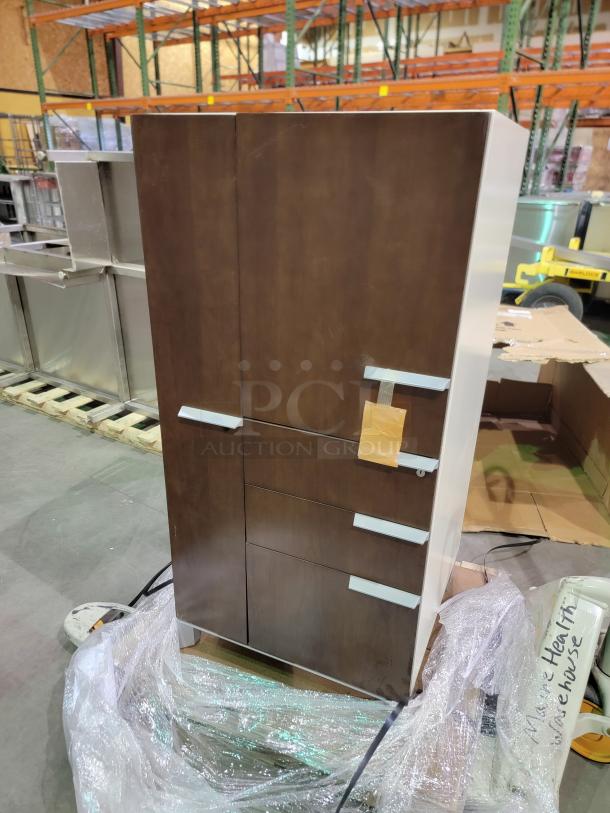 Healthe locking cabinet with dark wood veneer and white chassis. Features integrated lock with key, shelving, and deep drawers.