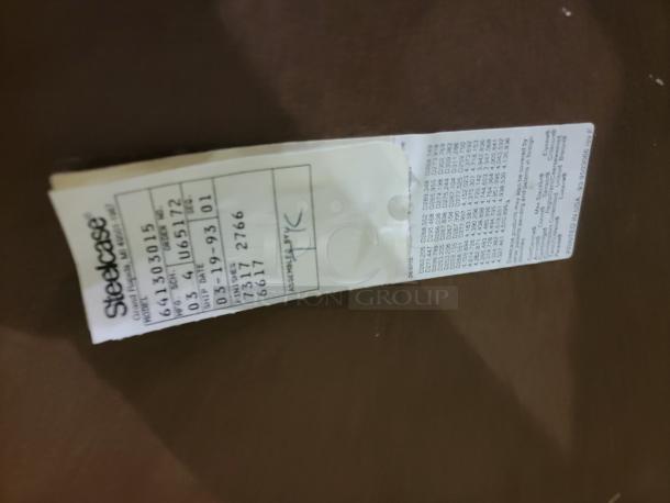 Label on a vintage Steelcase 30" end table indicating build date: March 19, 1993. Model U65172, Finish 2766.