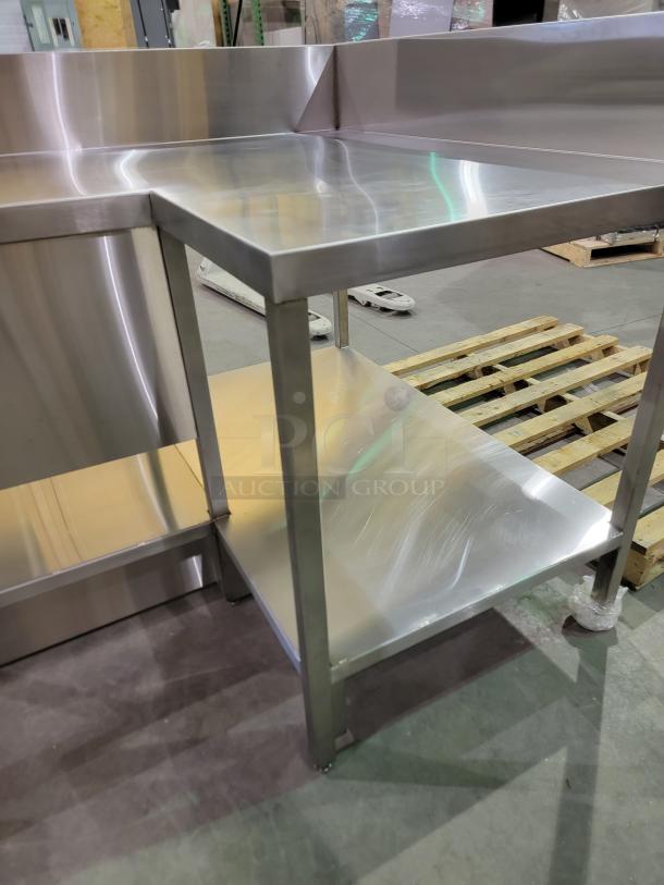 L-shaped stainless steel prep station with sink, 8-inch backsplash, and undershelf. Professional-grade, ideal for high-volume use.