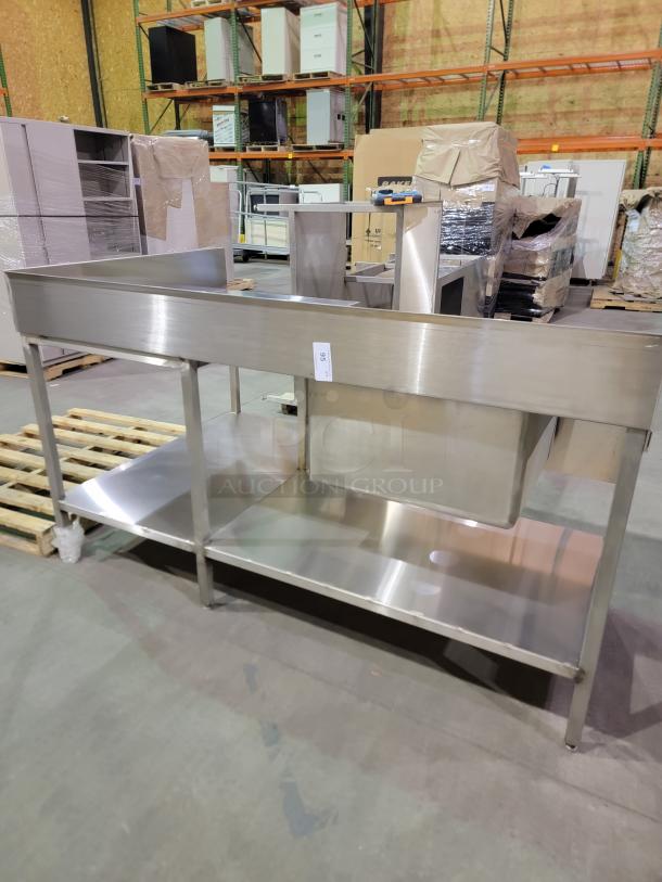 L-shaped stainless steel prep station with integrated sink, 8-inch backsplash, and undershelf, suited for high-volume kitchens.