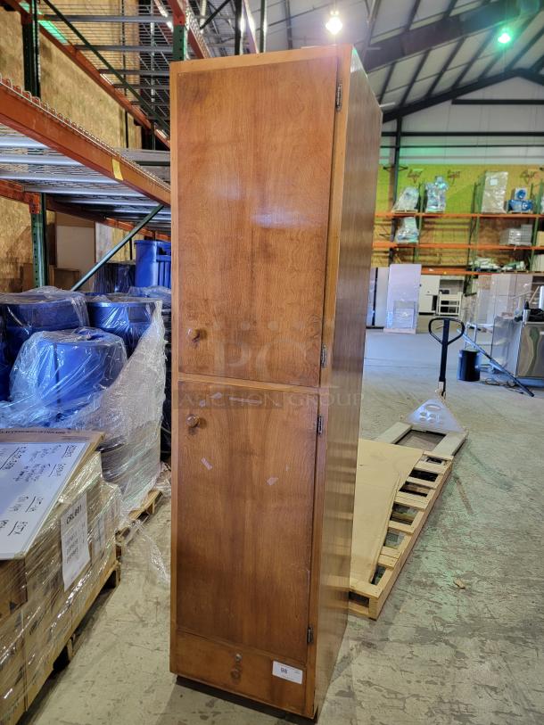 Solid wood storage cabinet in honey-oak finish, two vertical compartments, wooden knobs, adjustable shelves, smooth-gliding drawer.