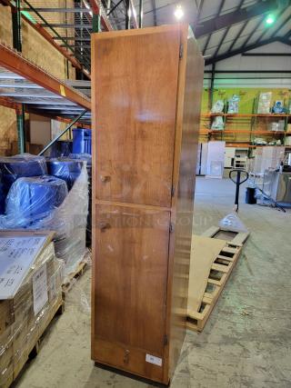 Solid wood storage cabinet in honey-oak finish, two vertical compartments, wooden knobs, adjustable shelves, smooth-gliding drawer.