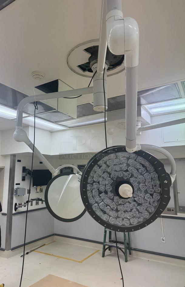 STERIS Harmony LED surgical lighting system with ceiling mount, dual light heads for shadow reduction and cool illumination.