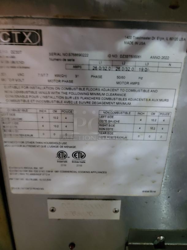 Metal plate on a 2022 Middleby Marshall CTX DZ33T conveyor oven with serial and model numbers, installation details, and ETL certification.