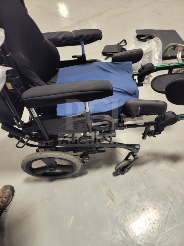 Premium Quickie IRIS tilt-in-space wheelchair, excellent condition, JAY backrest, pressure-relief cushion, elevating leg rests.