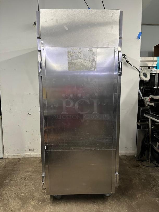 VICTORY ULTRA SPEC roll-thru solid door refrigerator, stainless steel, industrial grade, visible wear, ideal for commercial use.