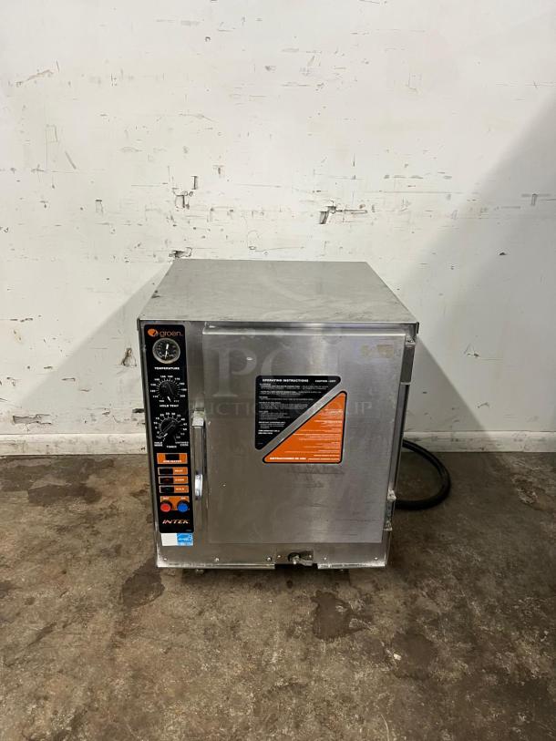 Late model 2023 GROEN XS-208-12 countertop convection steamer. Stainless steel finish, excellent condition. Front panel controls visible.
