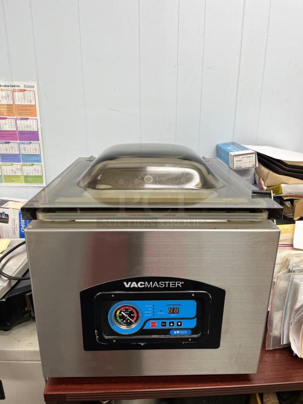 VacMaster VP320 Chamber Vacuum Packaging Machine, stainless steel, 16" seal bar, digital controls, excellent condition.