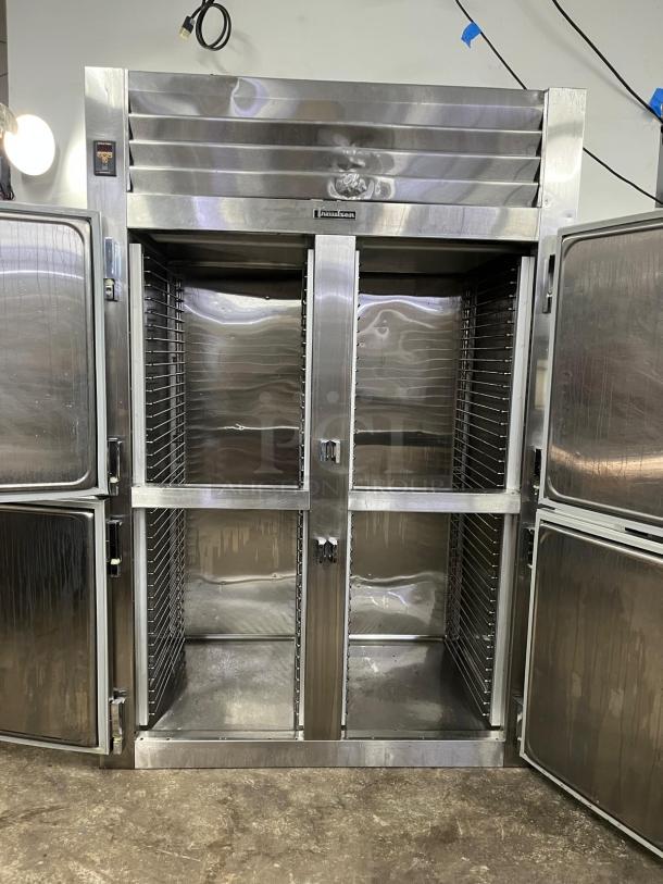 TRAULSEN RHT232NUT stainless steel refrigerator, 46 cu. ft., two-section half door, narrow reach-in, clean condition.