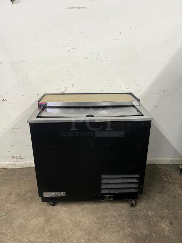 TRUE T-36-GC-HC 36 3/4" black glass froster and plate chiller in used condition, features a sleek design with visible brand logo.