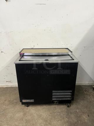 TRUE T-36-GC-HC 36 3/4" black glass froster and plate chiller in used condition, features a sleek design with visible brand logo.