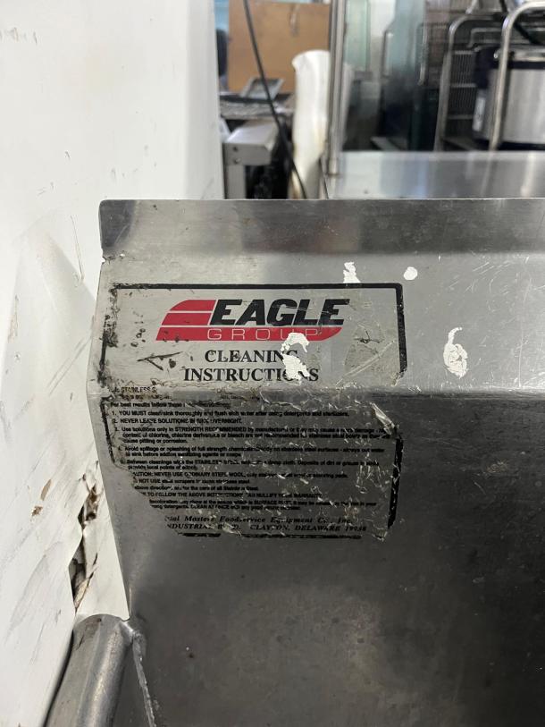 Eagle Group 3 Compartment Sink, stainless steel, visible cleaning instructions label, durable commercial use.