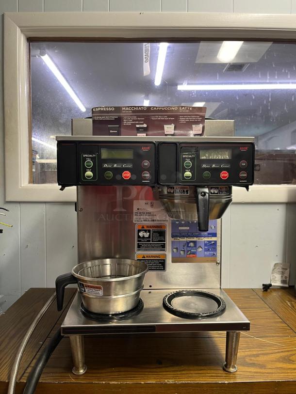 BUNN AXIOM 38700.0096 coffee brewer with 2 upper and 2 lower warmers, stainless steel, visible warning labels, excellent condition.