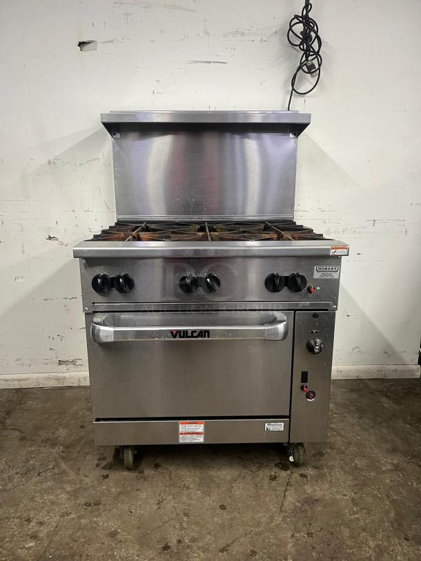 VULCAN 36S-6B 36" gas range with 6 burners and standard oven. Natural gas. Metallic finish, clean condition.