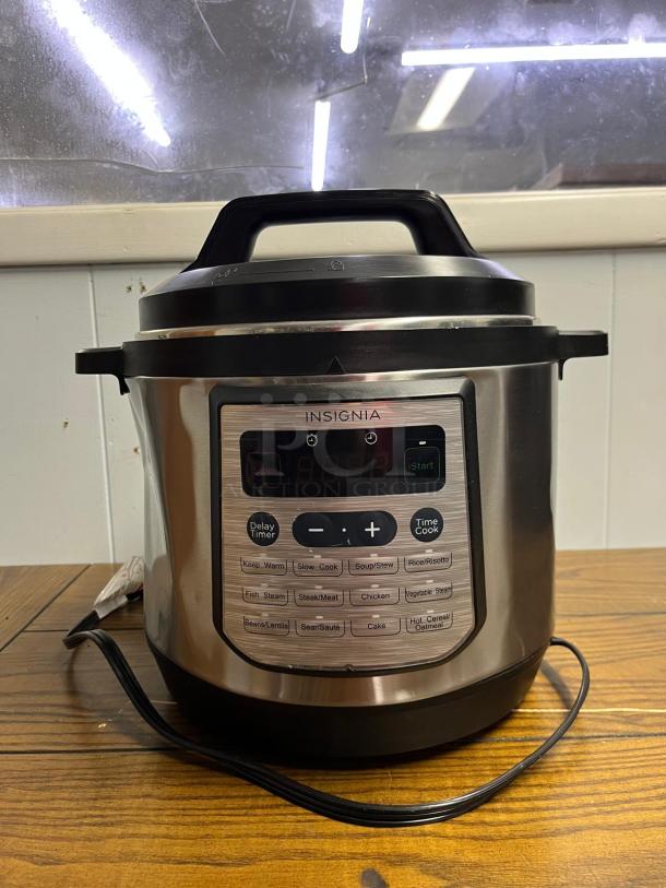 INSIGNIA 6QT Rice Cooker with 12 programmable settings, stainless steel finish, digital display, excellent condition.