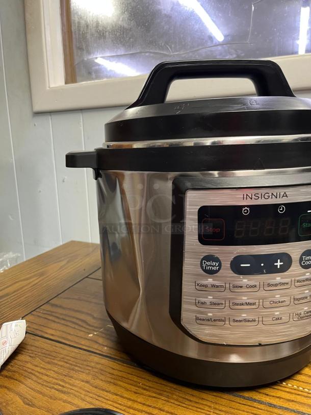 INSIGNIA 6QT rice cooker with 12 programmable settings, stainless steel finish, and digital display, in excellent condition.