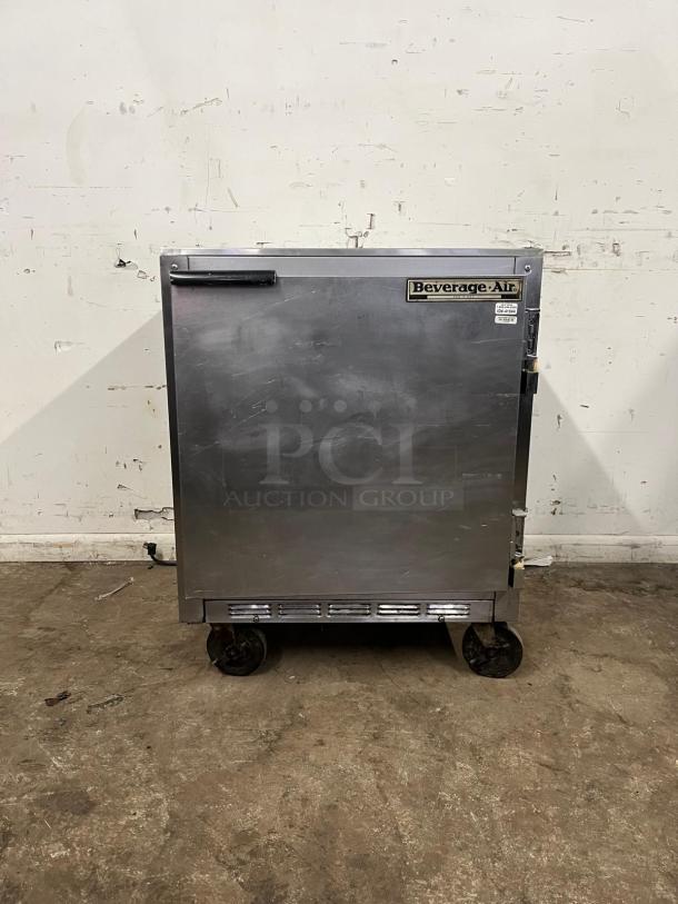 Beverage-Air 27" undercounter refrigerator, stainless steel, on casters, visible logo, used condition.