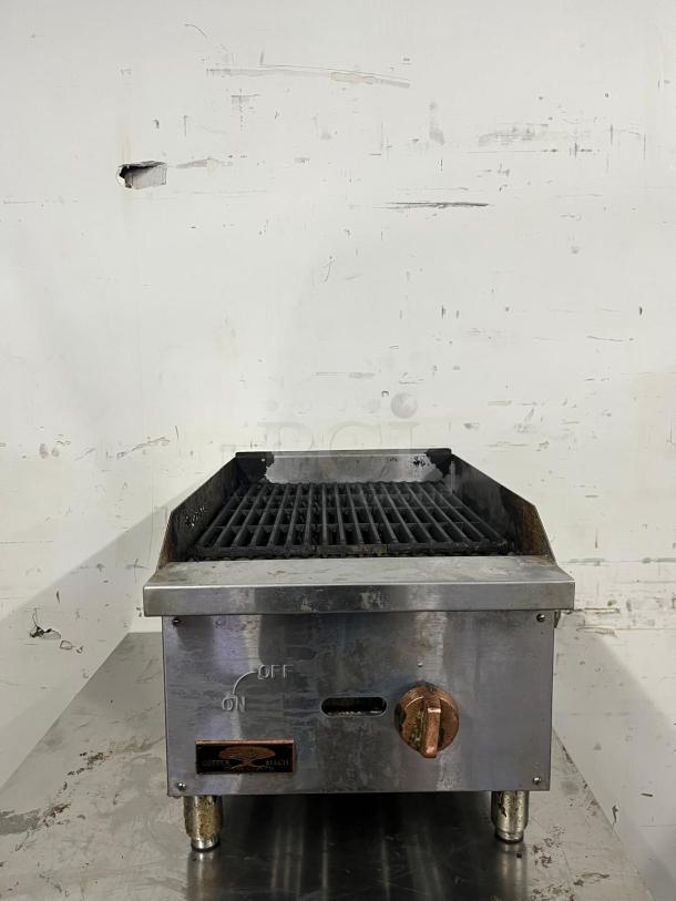 Star-Max countertop 15in radiant gas charbroiler with metal construction. Features on/off knob, showing signs of use.