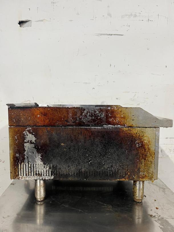 Star-Max Countertop 15in Radiant Gas Charbroiler, visibly used, with rust and discoloration, on metal legs.