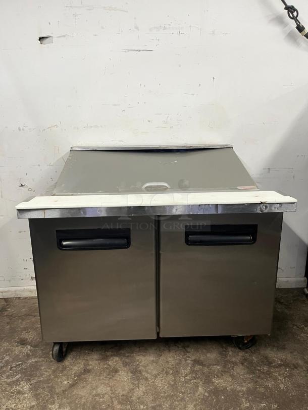 BLUE AIR BLMT48-HC refrigerated prep table, 48" wide, two swing doors, stainless steel, 13.1 cu. ft., on wheels, used.