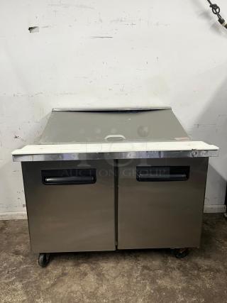 BLUE AIR BLMT48-HC refrigerated prep table, 48" wide, two swing doors, stainless steel, 13.1 cu. ft., on wheels, used.