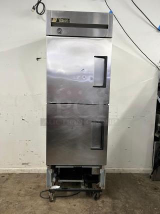 TRUE T-23-2 27" reach-in refrigerator with two left-hinge solid doors. Features visible brand label and dial gauge.