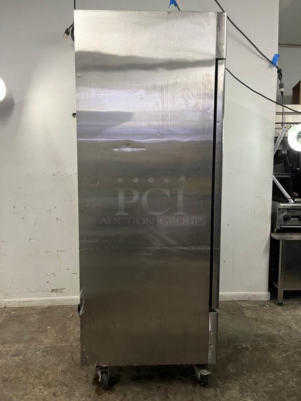 Atosa MBF8505GR 27" stainless steel refrigerator, 19.1 cu ft, ENERGY STAR®, visible dents, on casters, industrial use.