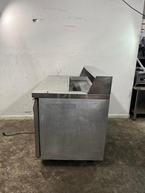 Continental SW48-12 refrigerated prep unit, 48" stainless steel, 13.4 cu ft, used condition, minor surface wear visible.