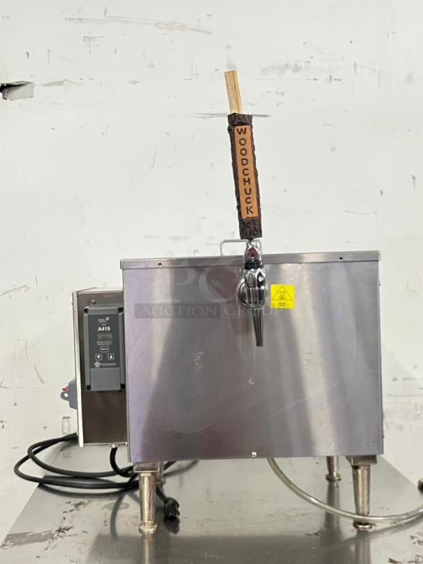 KEGRATOR commercial beer dispenser, stainless steel countertop keg cooler, tap handle labeled "WOODCHUCK," power cord attached.