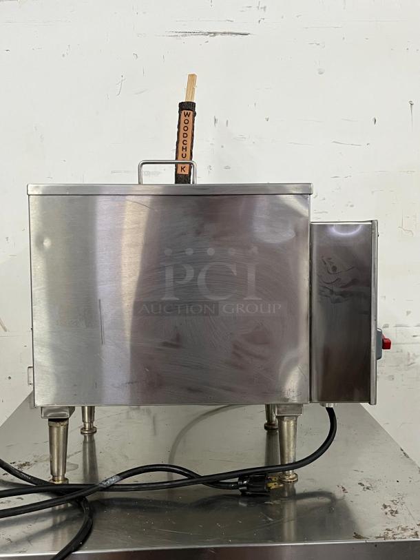 Commercial KEGRATOR beer dispenser, stainless steel, portable countertop keg cooler, features a "Woodchuck" tap handle.