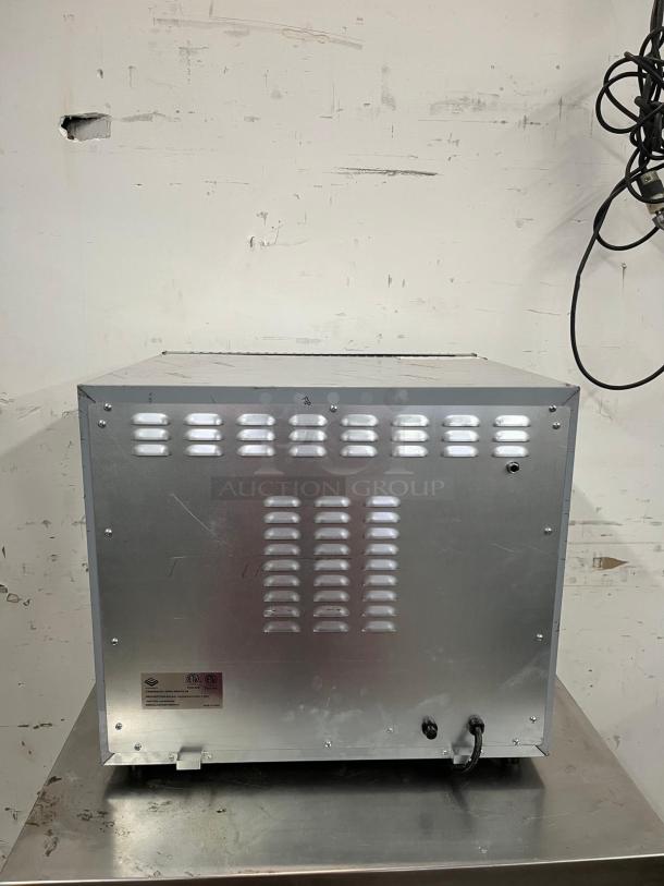 EVERNEW ENCOV-28 countertop convection oven, half size. Features vented back panel, visible wiring. Model label on back.