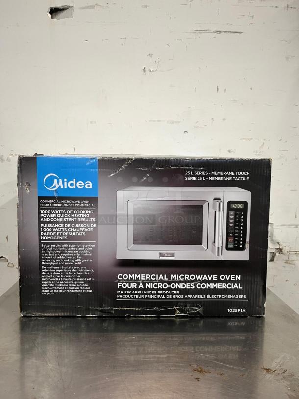 Midea 1025F1A 1000 Watt Light Duty .9 cuft Commercial Microwave in box, featuring membrane touch controls.