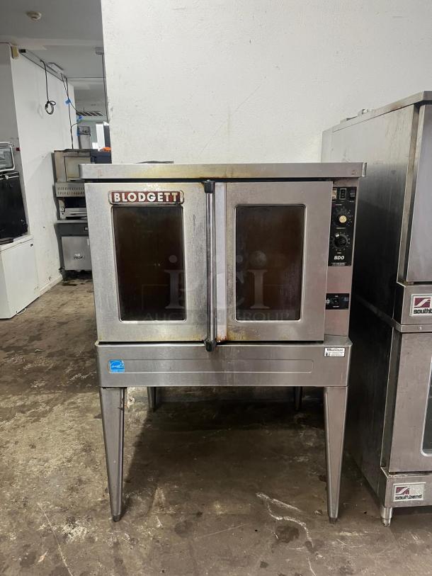 Blodgett BDO-100-G-ES convection oven, stainless steel, dual doors, model BDO-100, visible wear, manufacturer logo on door.